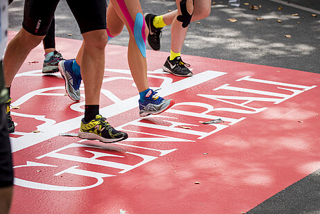 Runners on a Generali logo © Generali/ SCC Events